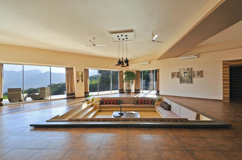 Beautiful sunken living room with large chandelier and vaulted ceiling Beautiful sunken living room with large chandelier and vaulted ceiling